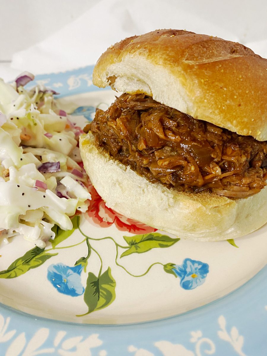 slow cooker beef sandwiches served with coleslaw