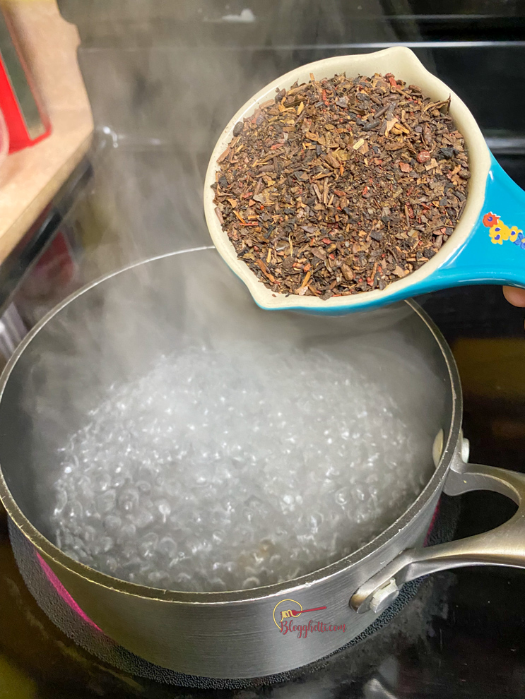 adding tea mix to boiling water