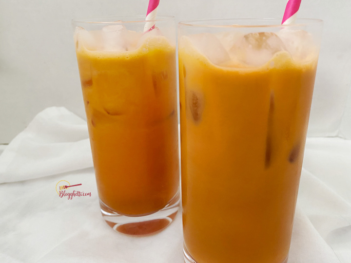 refreshing Thai tea iced in glasses with straws