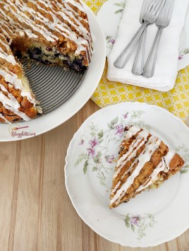blueberry streusel cake with slice on plate