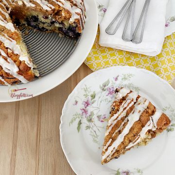 blueberry streusel cake with slice on plate