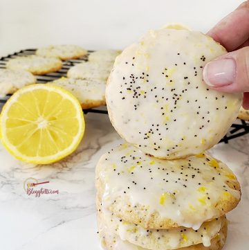stack of lemon cookies with poppy seeds in them