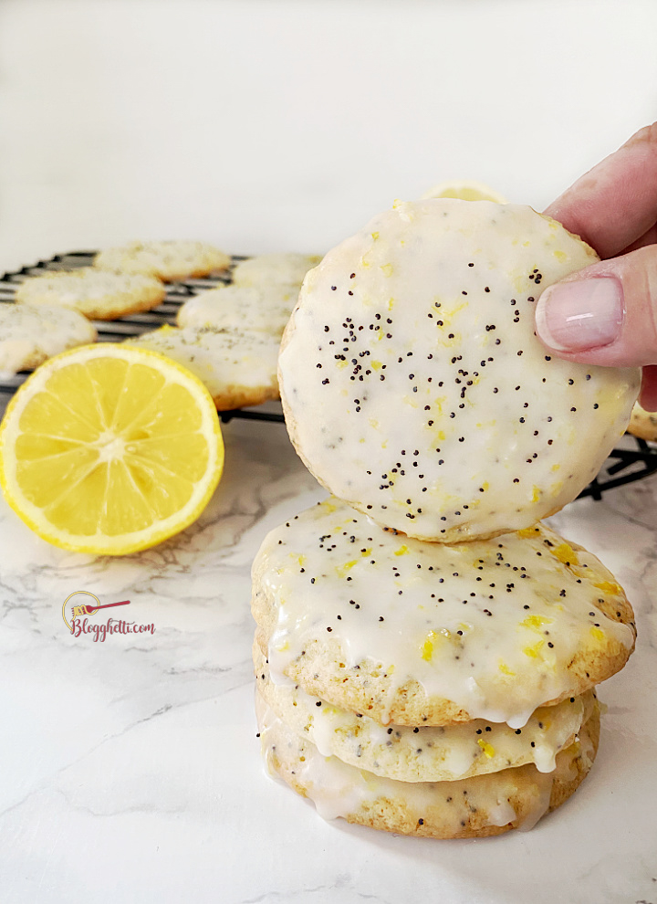 stack of lemon cookies with poppy seeds in them