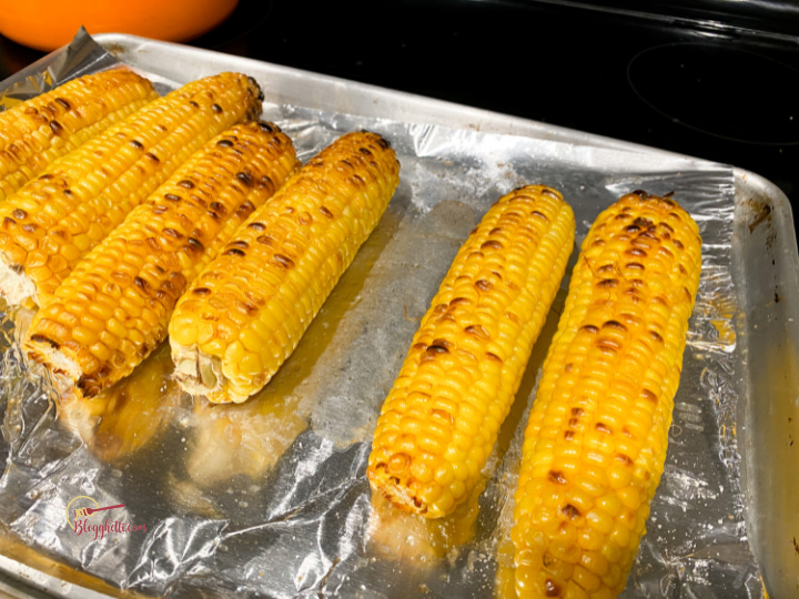 broiled charred corn on baking sheet