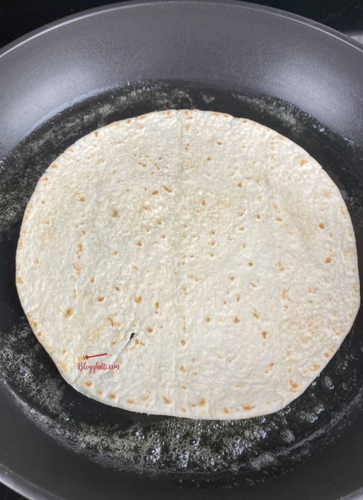 browing the flour tortilla in skillet