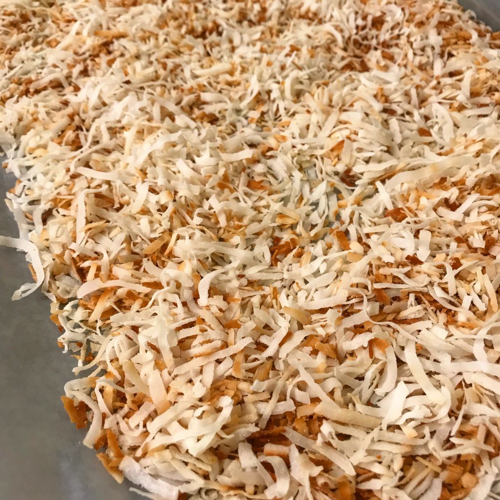 toasted coconut cooling on tray