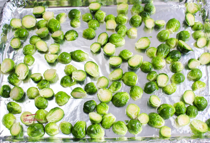 brussel sprouts ready to roast on sheet pan