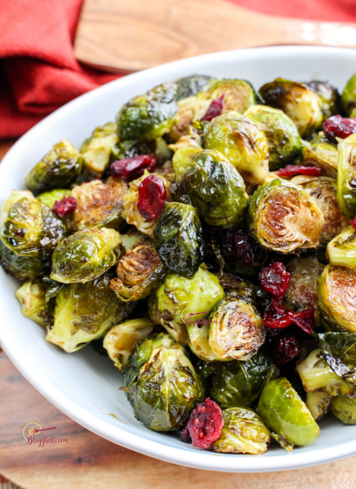 roasted balsamic brussel sprouts and cranberries in white bowl
