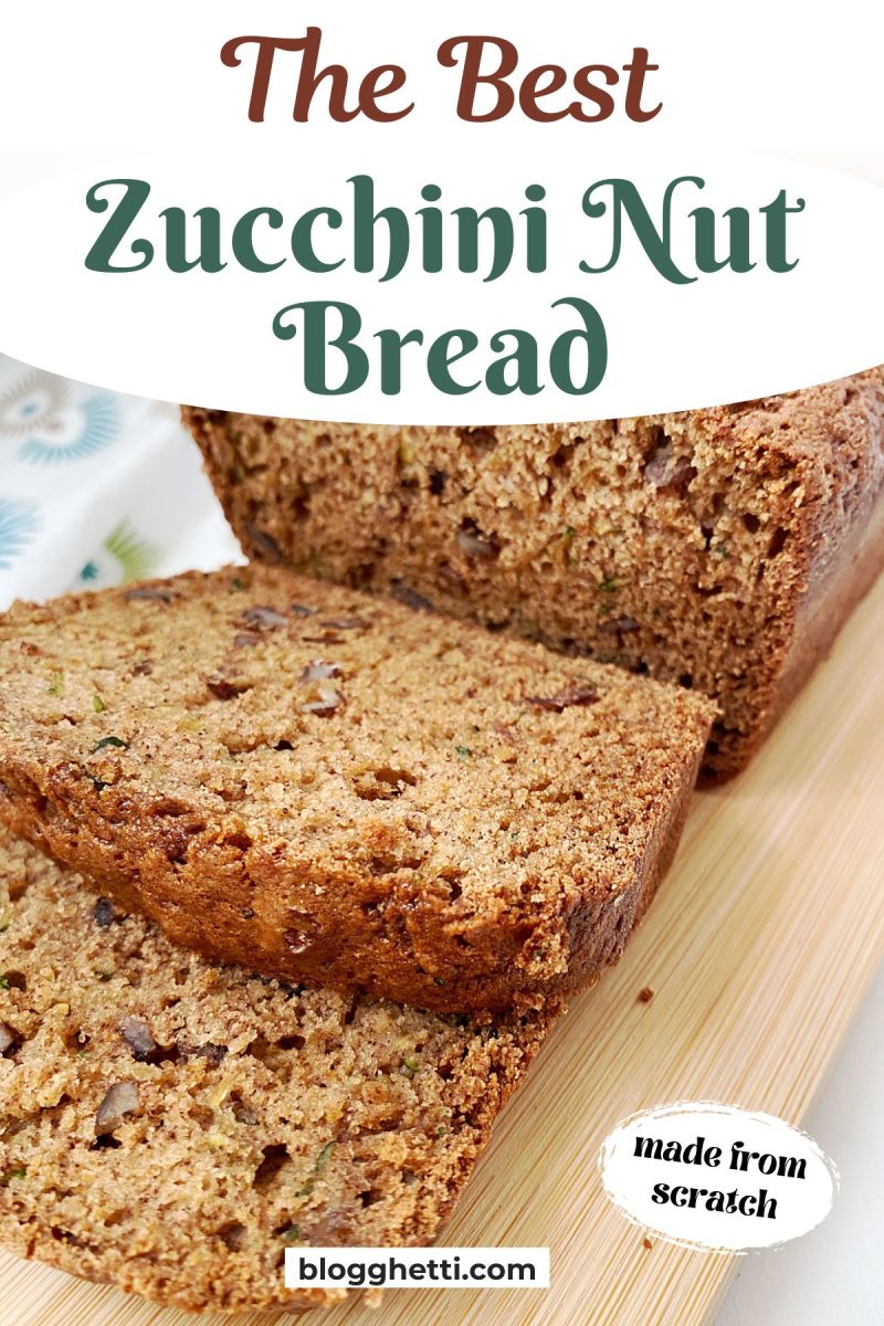A zucchini nut bread loaf with two slices on a wooden board, featuring text overlay "The Best Zucchini Nut Bread" and "made from scratch"