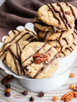 Turtle Chocolate Chip Cookies in white bowl stacked