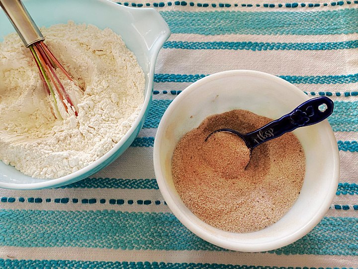 bowls of dry ingredients and chai spice mixture