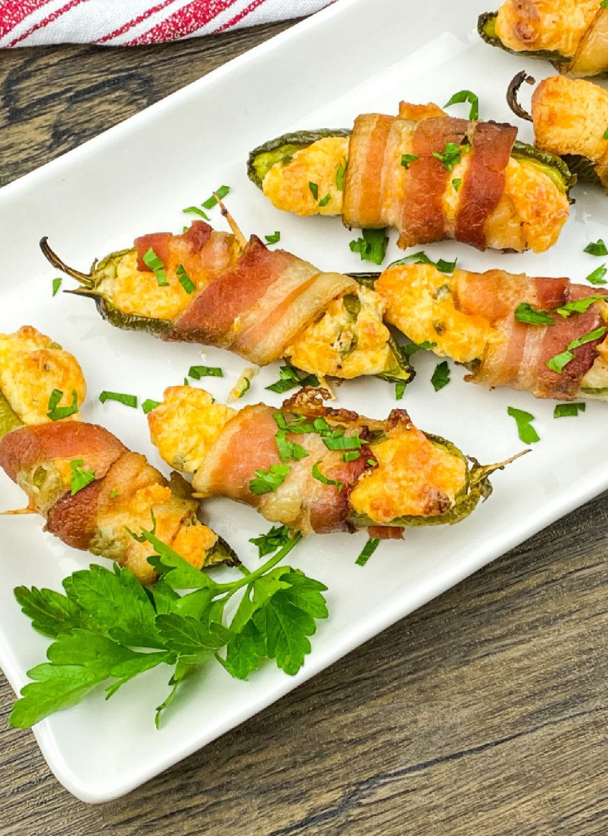 stuffed jalapenos on white platter