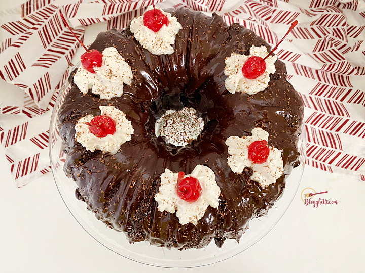 black forest cake with ganache on cake plate
