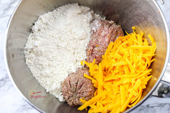 cheese, sausage, and bisquick in mixing bowl