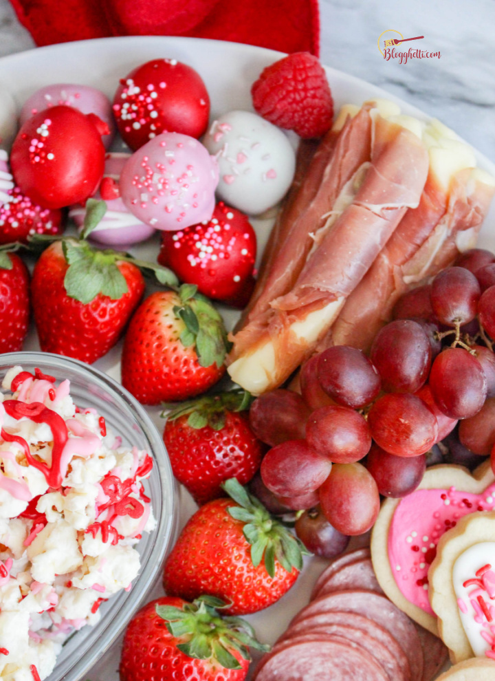 close up of charcuterie with fruit and meat