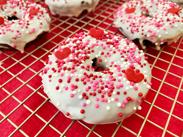 close up of frosted cake mix chocolate donut with sprinkles