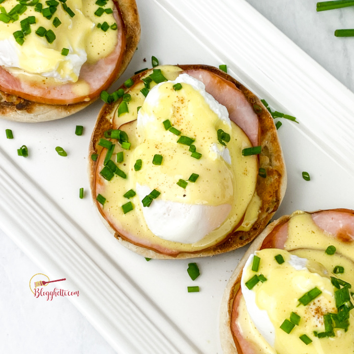 eggs benedict on a white platters