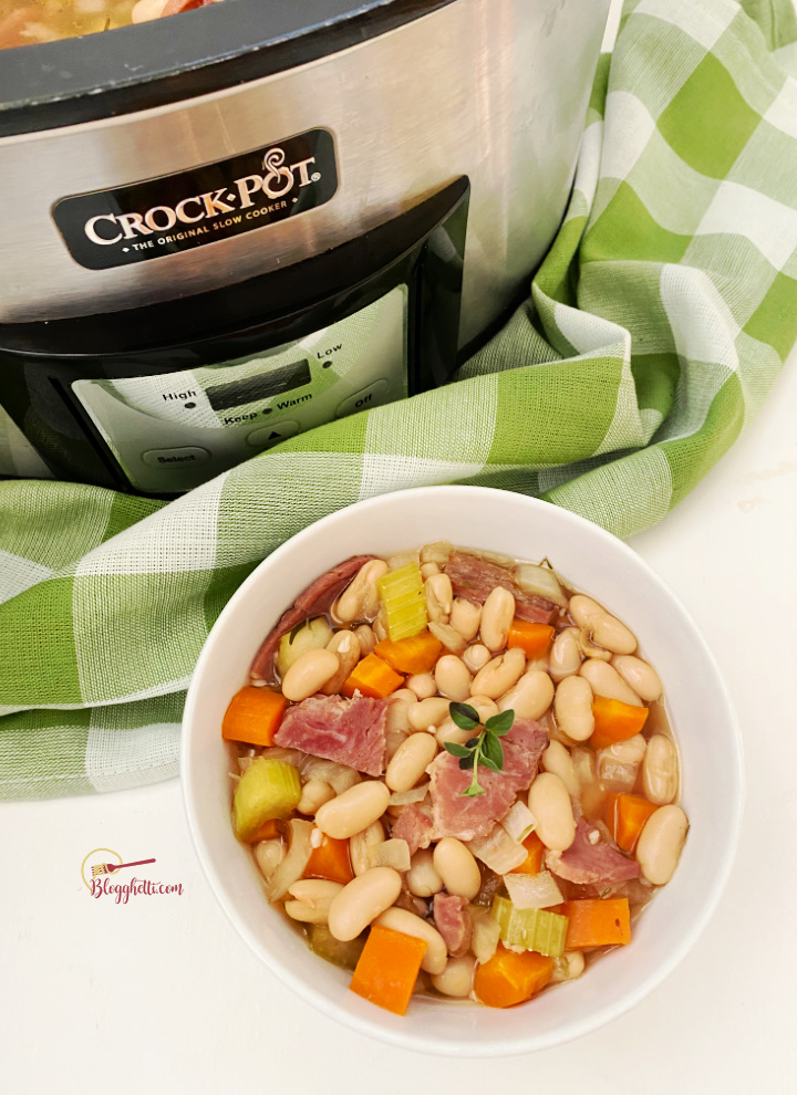 slow cooker and bowl of ham white bean soup