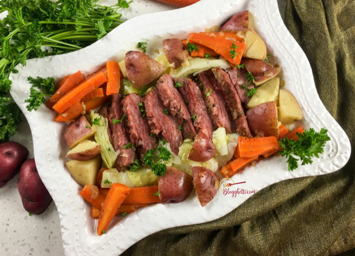 Instant pot corned beef and cabbage dinner on white platter