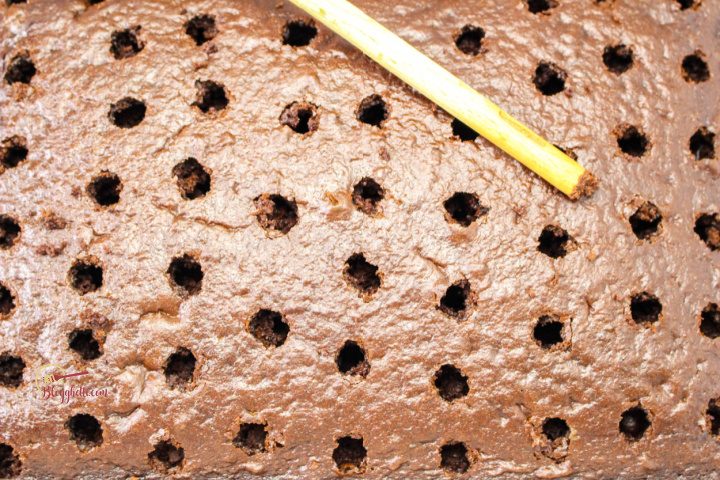 chocolate mint cake with holes poked in it