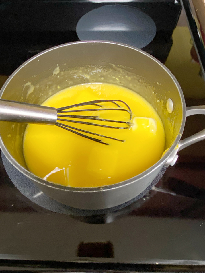 cooking the mango curd on the stovetop