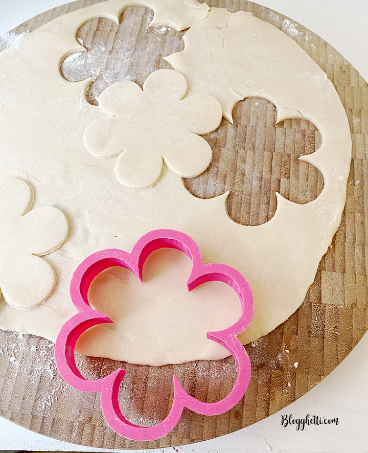 cutting out flower shapes from pie crust