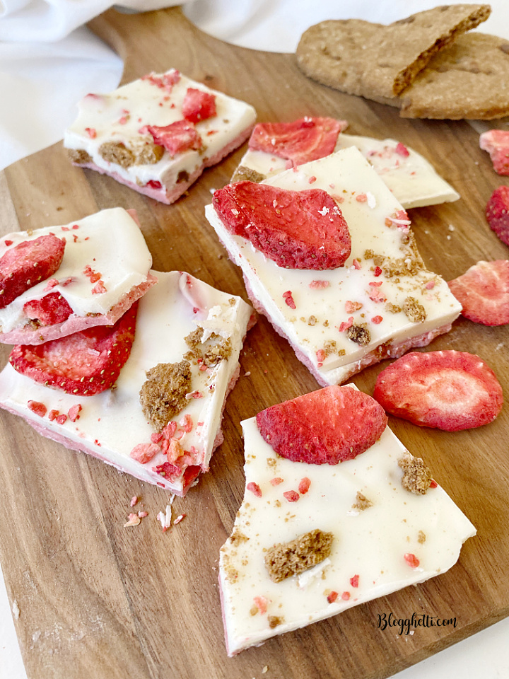 pieces of strawberry white chocolate bark on cutting board