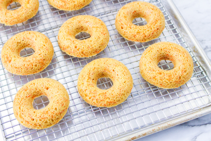 baked carrot cake donuts cooling on wire rack