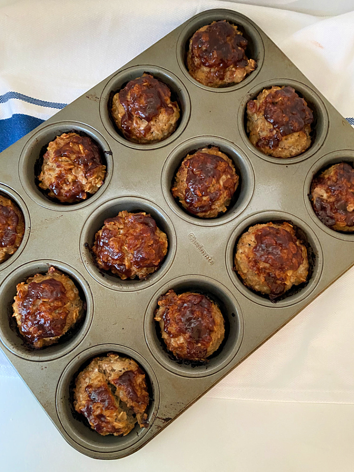baked mini turkey meatloaves with BBQ sauce in a muffin tin