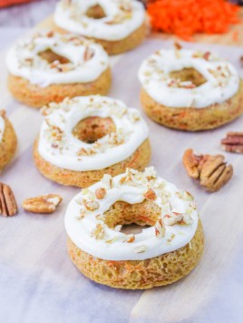 carrot cake donuts with icing and pecans