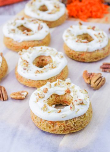 carrot cake donuts with icing and pecans