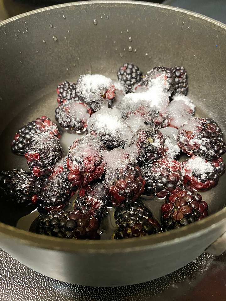 blackberries and sugar in saucepan