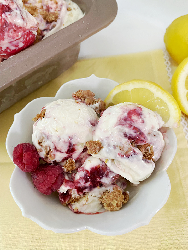 close up of bowl with lemon raspberry cheesecake ice cream