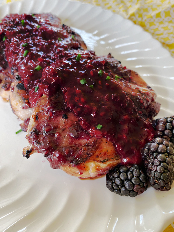 close up of grilled chicken with blackberry glaze