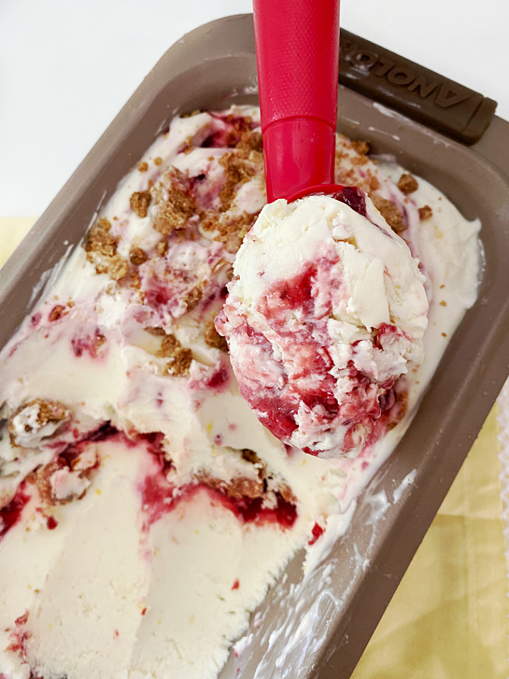 close up of ice cream scoop with lemon raspberry ice cream