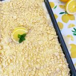 lemon poke cake with lemon cookie crumbles