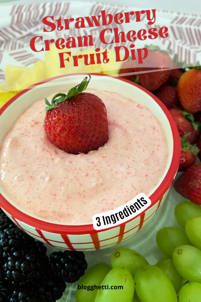 strawberry fruit dip in red and white bowl on a fruit platter.  Also, image has text overlay