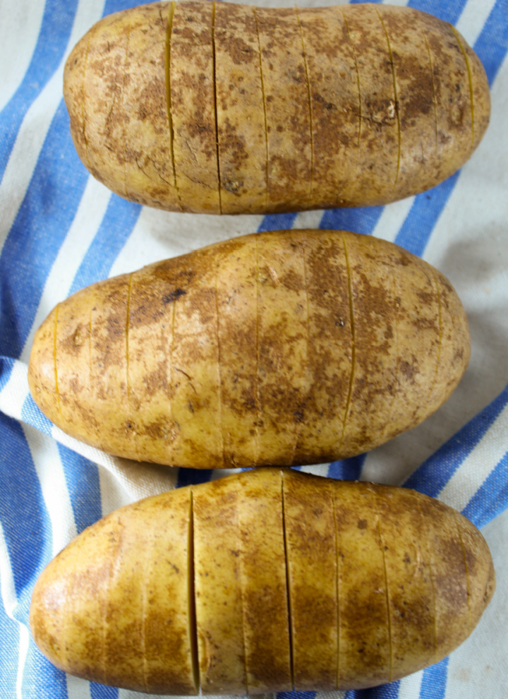 baking potatoes with slits cut into them