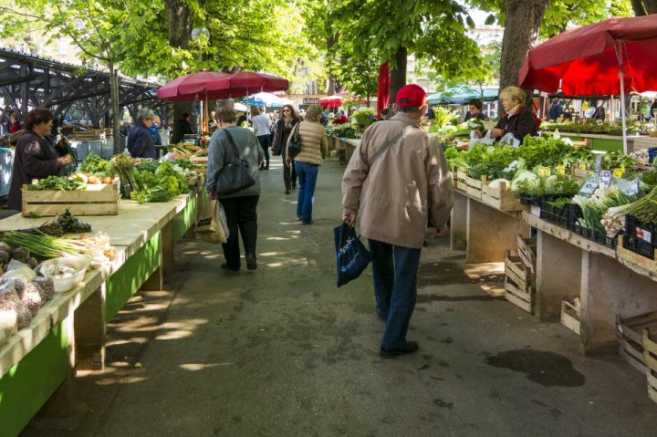 people shopping at a farmer market