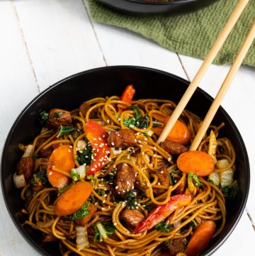 Instant Pot Pork lo Mein in blue bowls with chopsticks