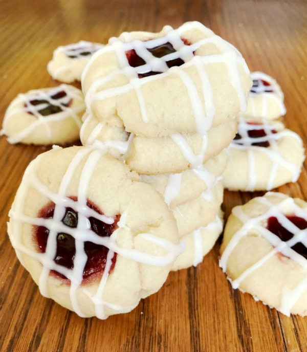 Raspberry Shortbread Cookies are buttery with a bit of raspberry jam in the center, and topped with a almond glaze. 