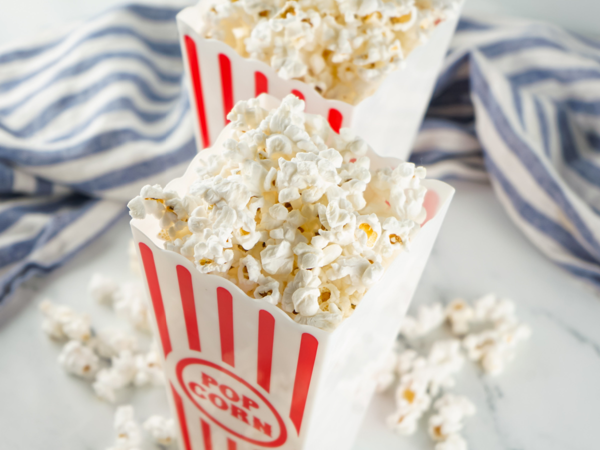 close up of instant pot popcorn in red and white containers