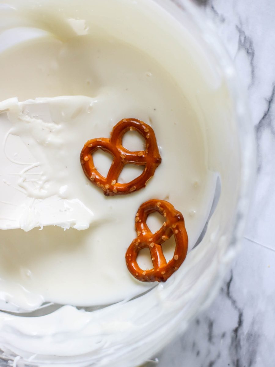 dip pretzels into melted white chocolate