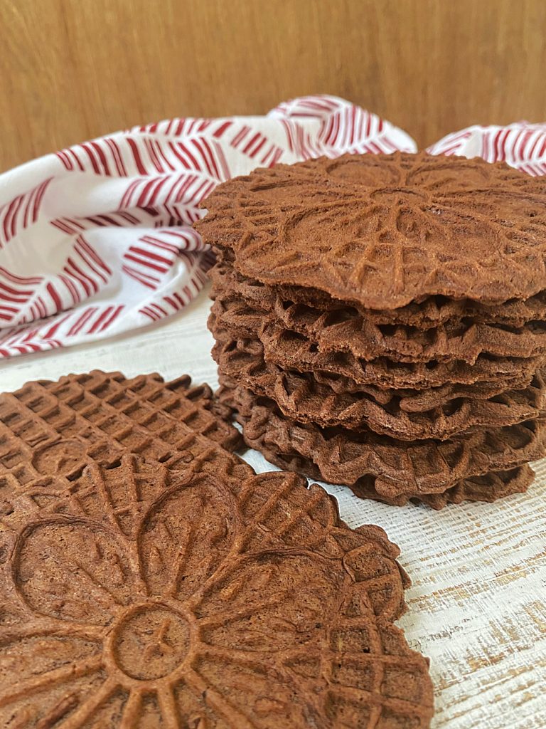 mint chocolate pizzelles on wooden board