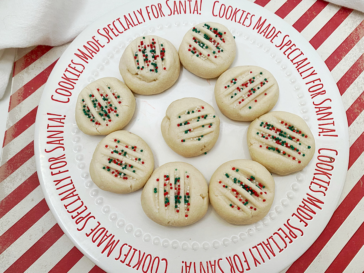 santa cookie plate filled with whipped shortbread cookies