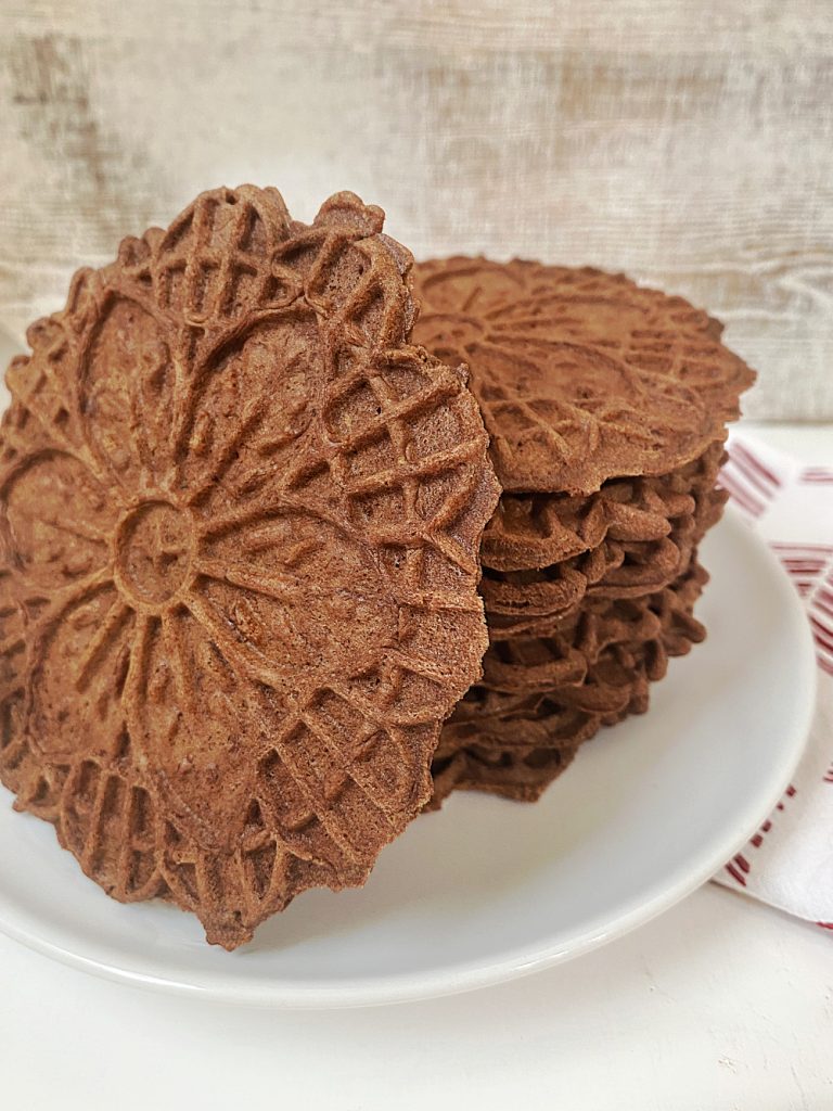 stack of pizzelle cookies made with chocolate and mint