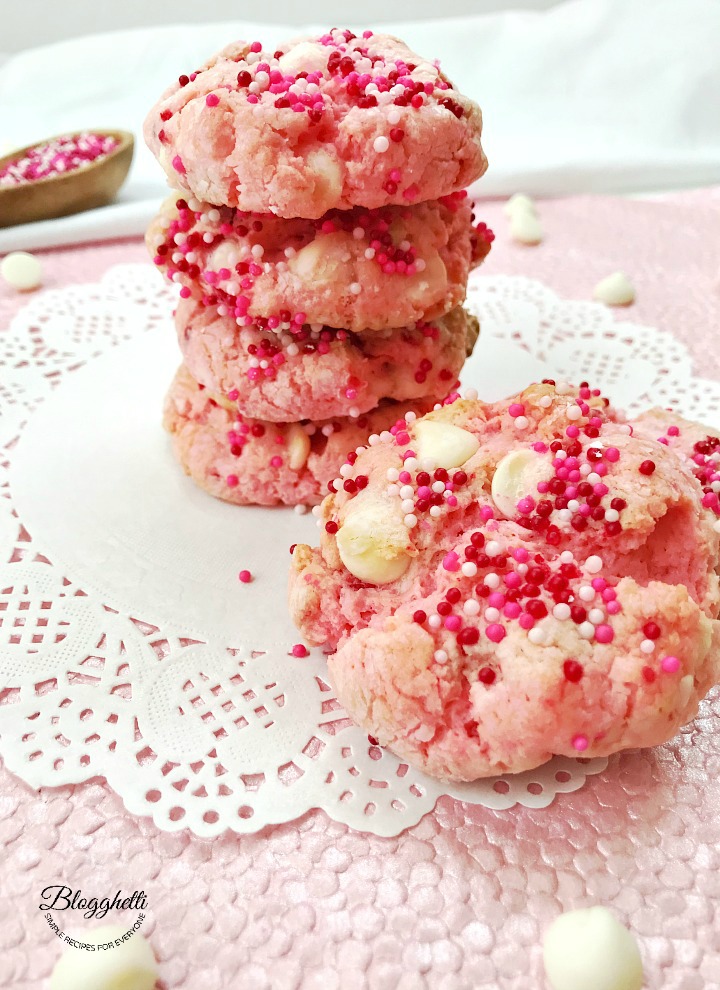 Strawberry Cheesecake Crinkle Cookies start with a cake mix.  Adding a few other ingredients and, of course, sprinkles and you have one yummy cookie.