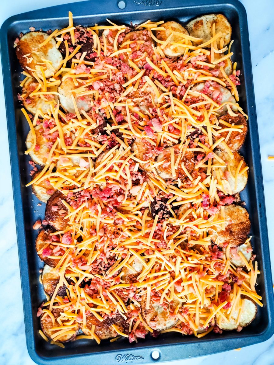 add bacon pieces over the cheese and potatoes