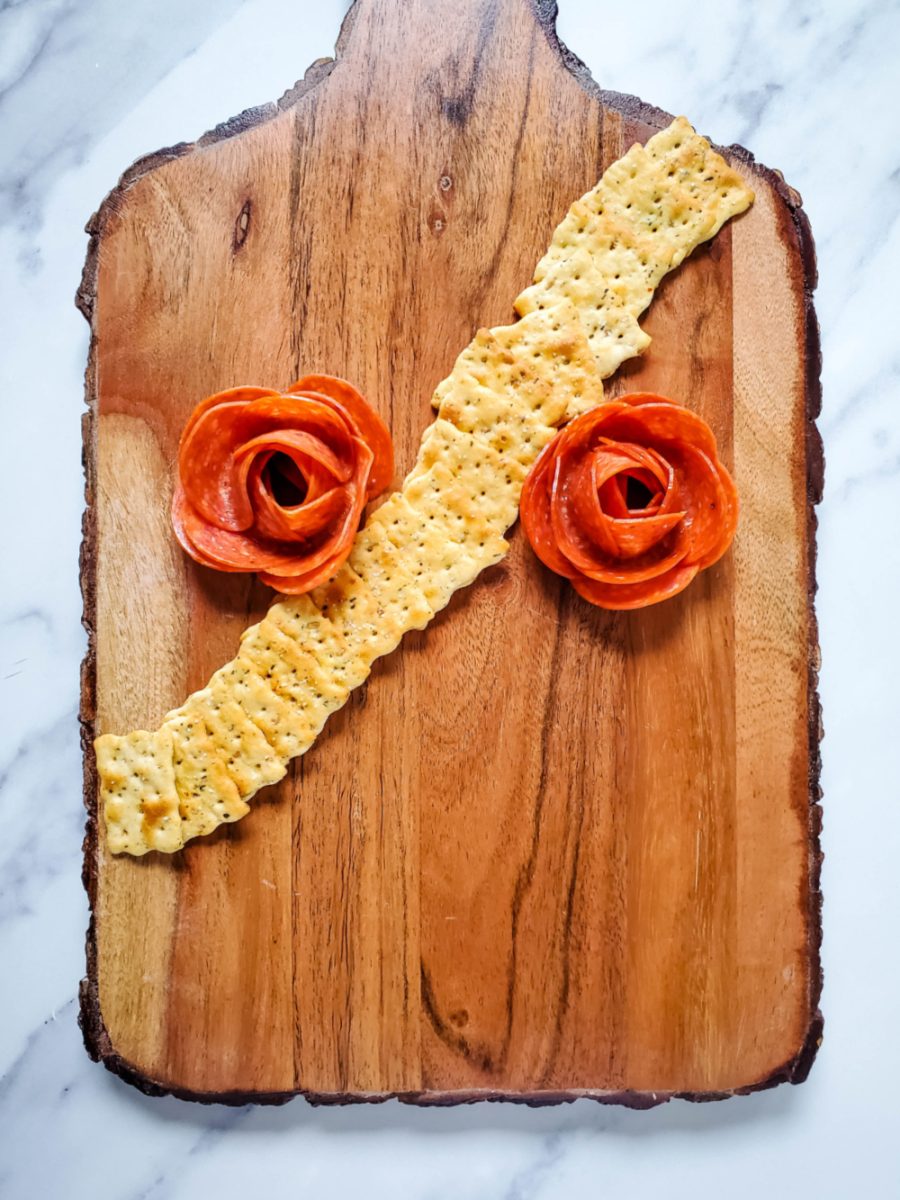 adding pepperoni roses to board