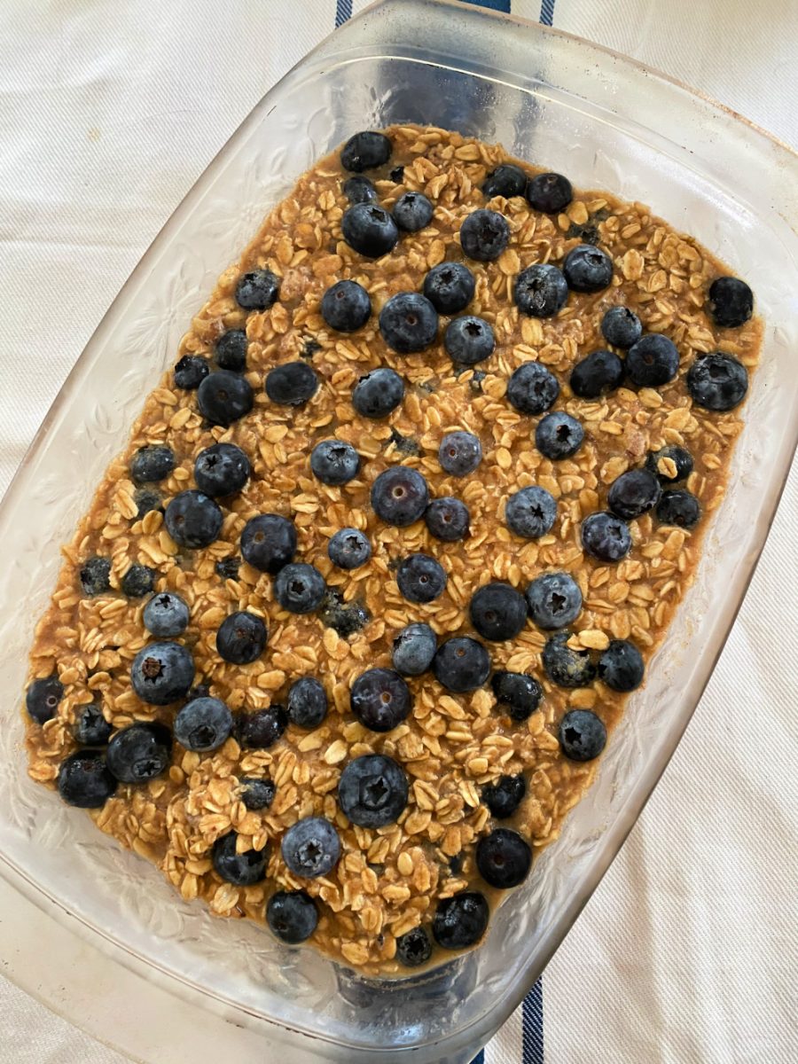 baking with another layer of oatmeal and topped with more blueberries
